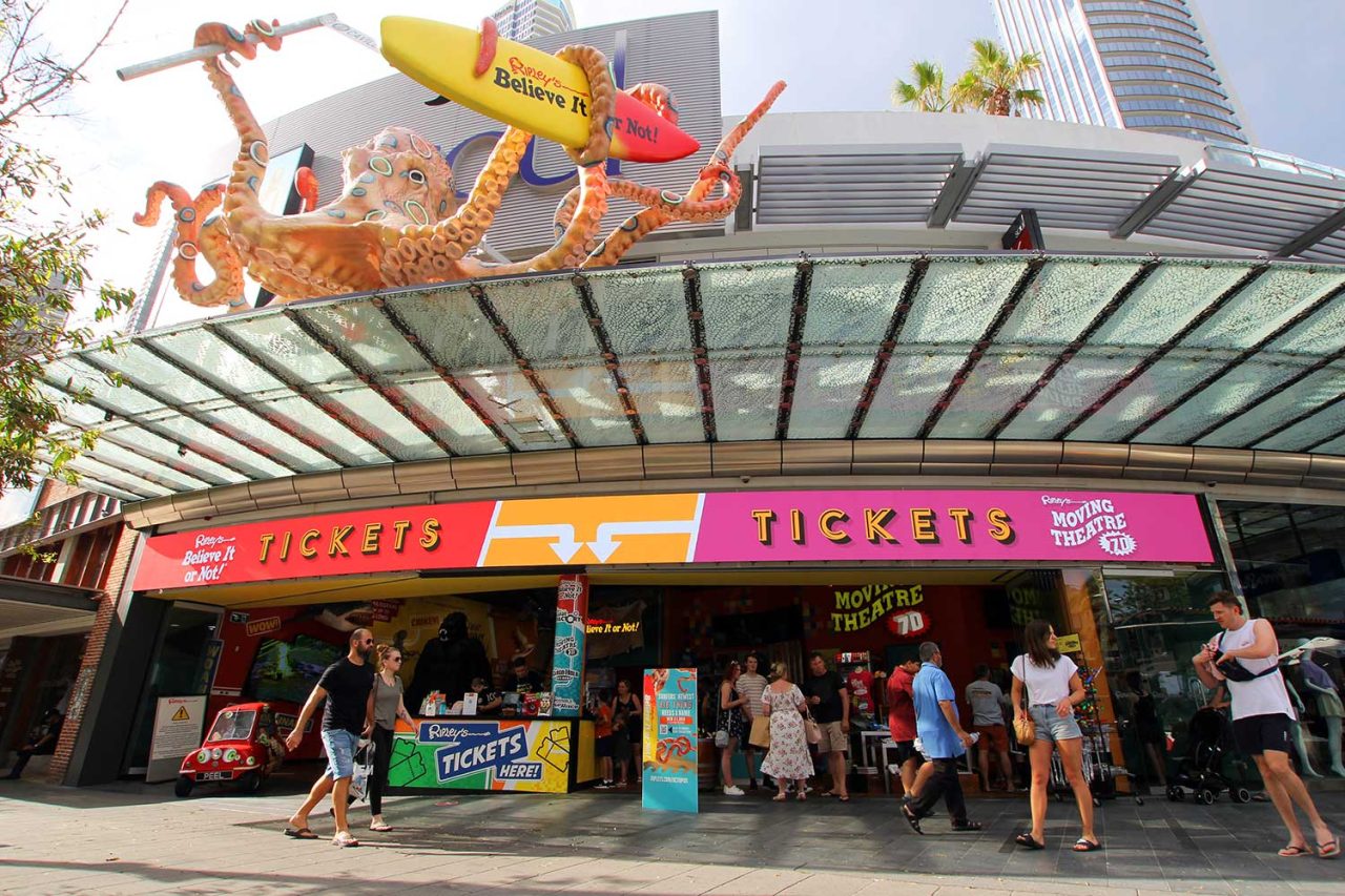 Ripley’s Believe It or Not! entrance with a curved digital ticket sign beneath the glass canopy.