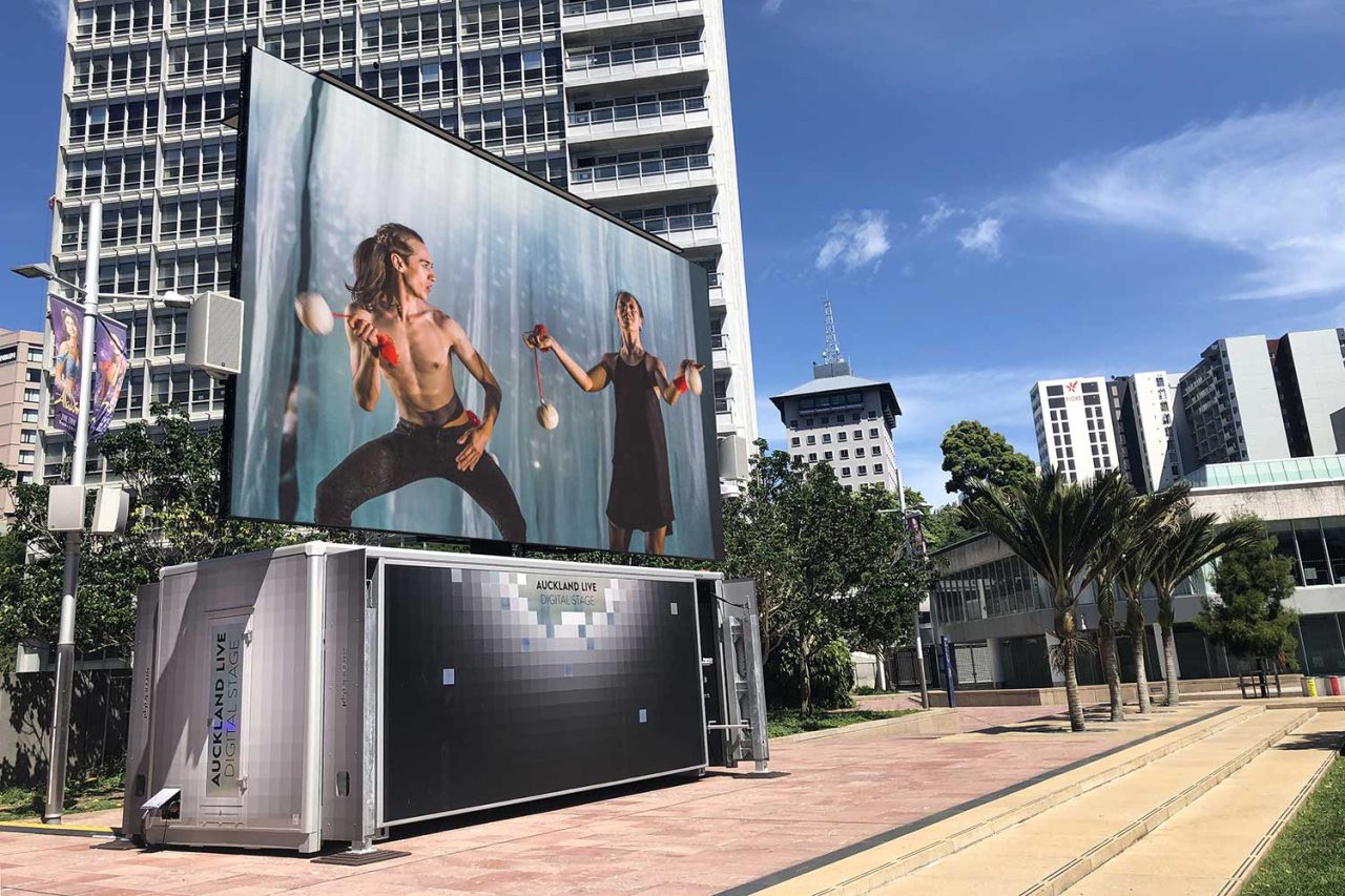 Performance footage on the Auckland Live Digital Stage in the city plaza.