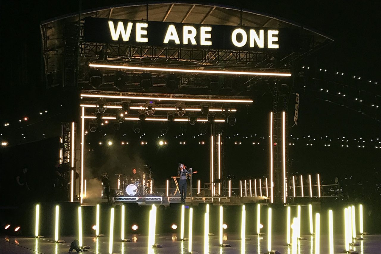 We Are One stage surrounded by upright light tubes for the Field of Dreams New Year’s Eve production.