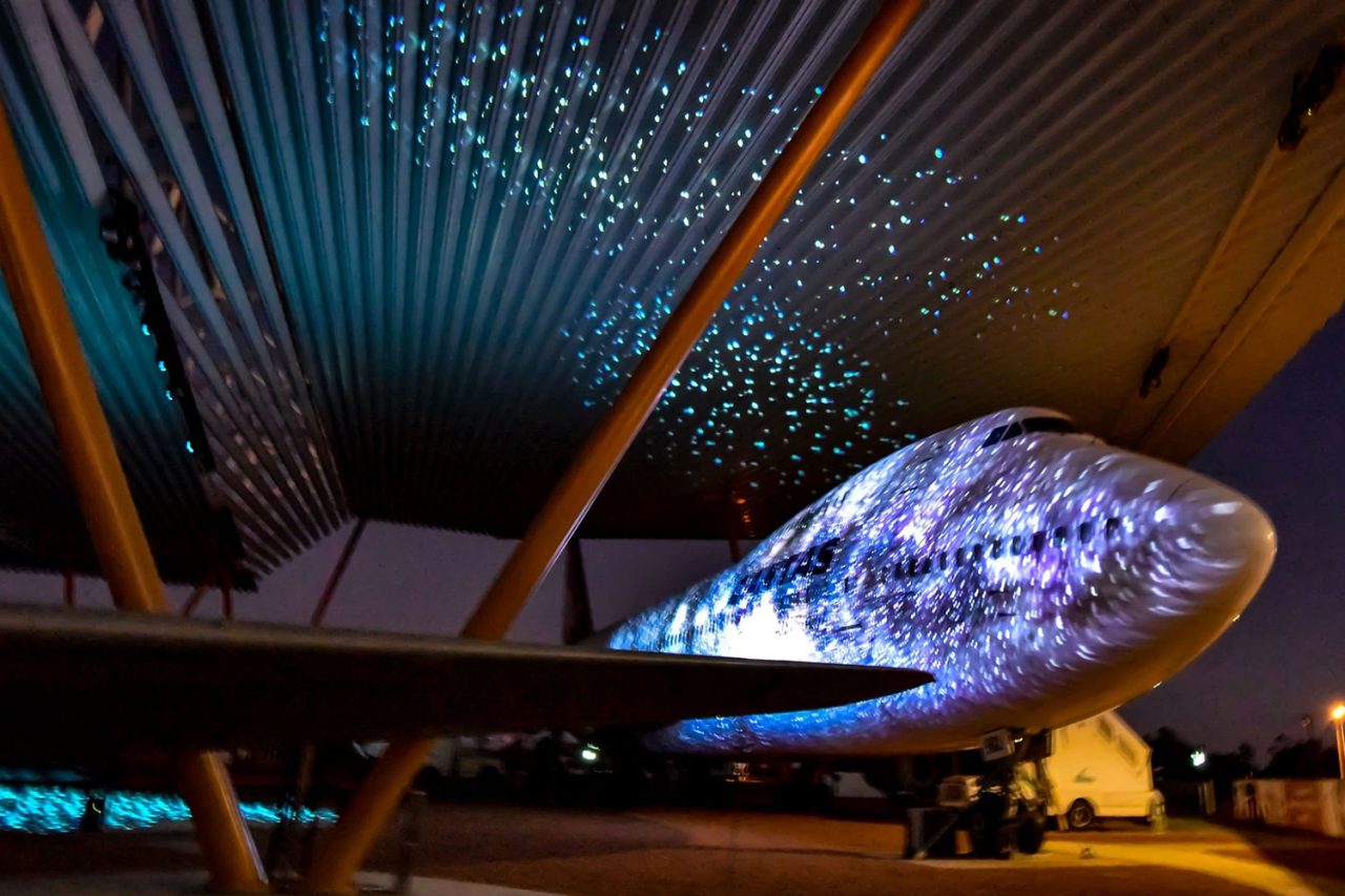 Star-like projections across an aircraft and the canopy at Qantas Founders Museum.