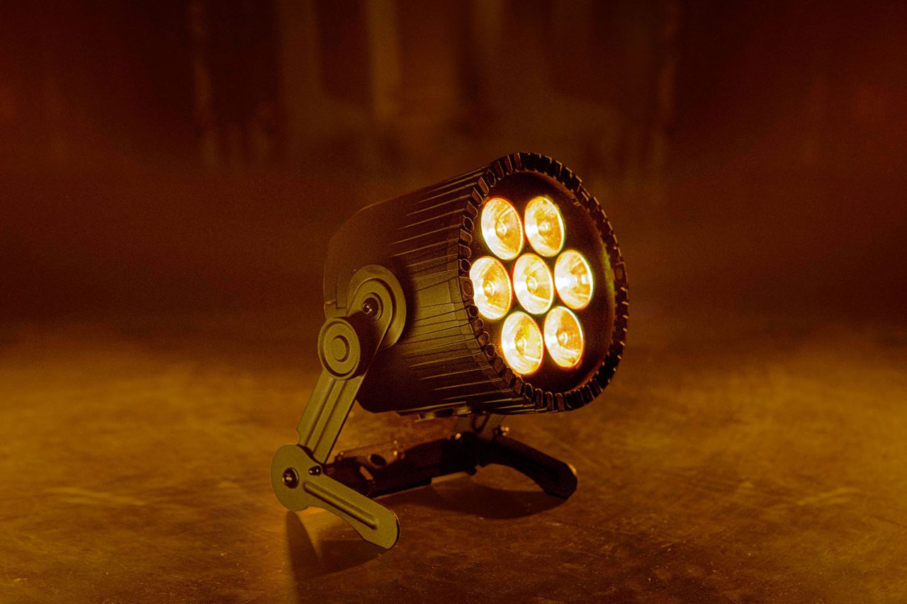 Astera AX9 PowerPAR emitting warm amber light.