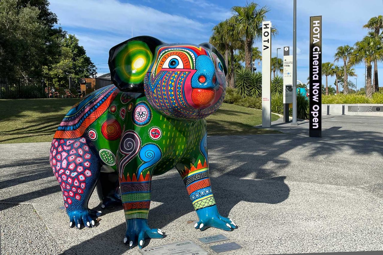 Koala sculpture and HOTA Gallery opening signs in the cultural precinct.
