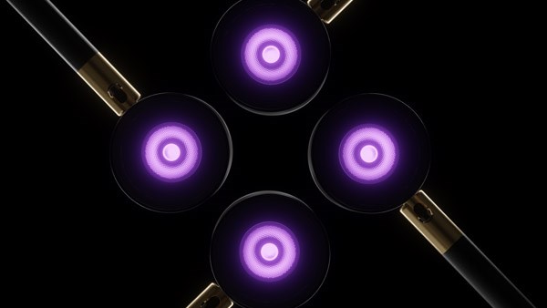 Four Griven Moon fixtures emitting purple light.