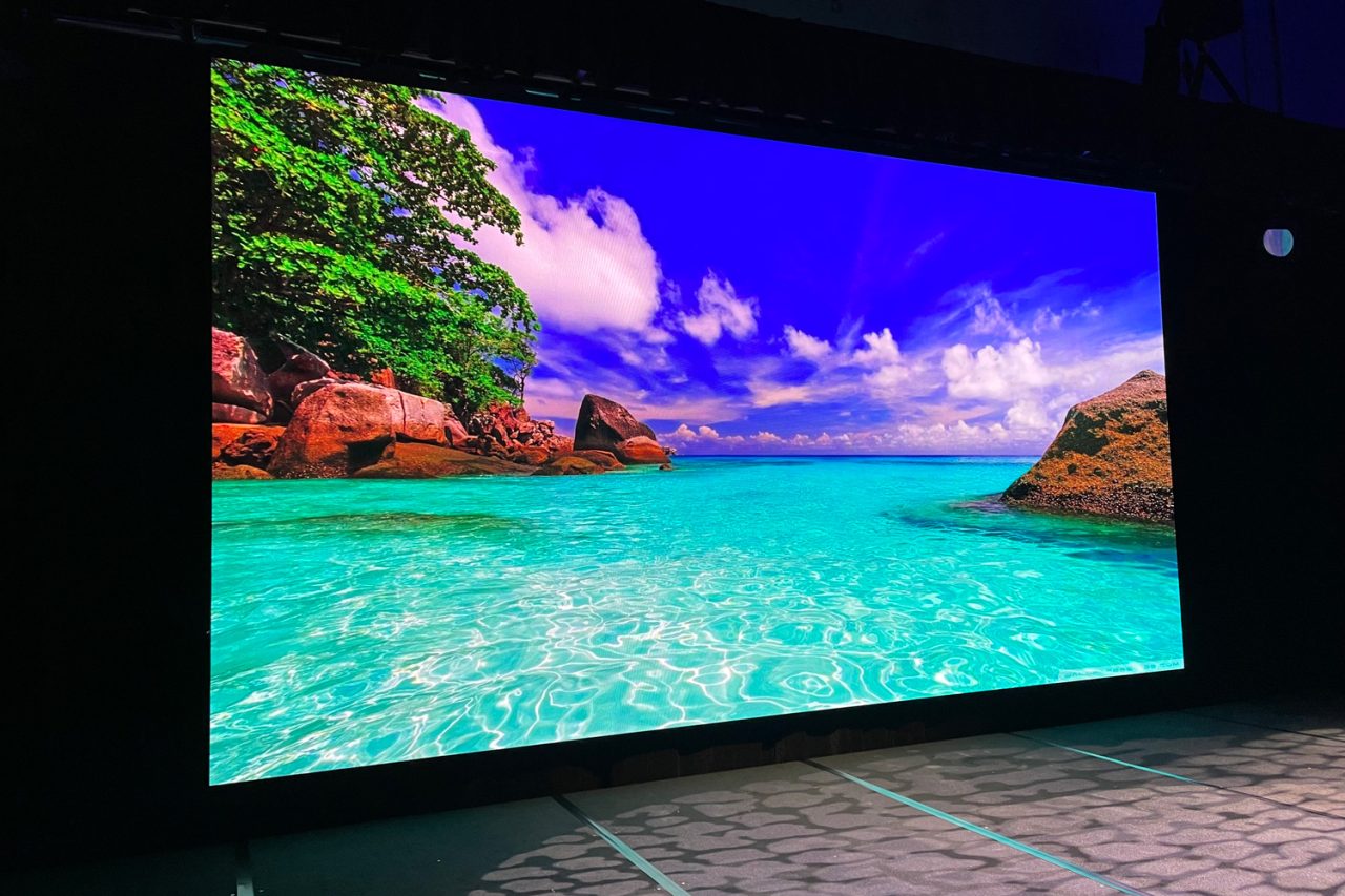 Tropical beach imagery on a large VuePix screen at Elite Event Technology.