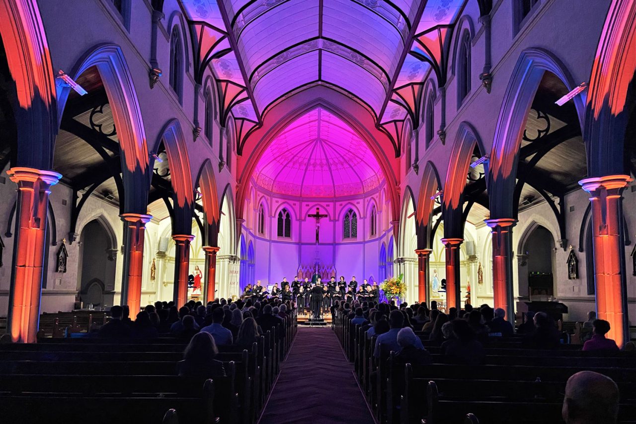 View along the nave towards the purple-lit dome at St Joseph's Church in Subiaco.