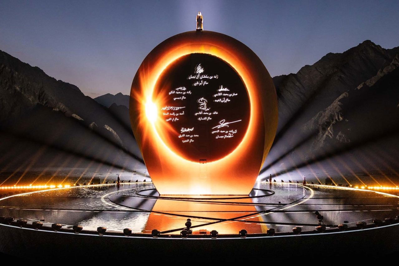 Glowing golden circular display at the UAE's 50th National Day celebration.