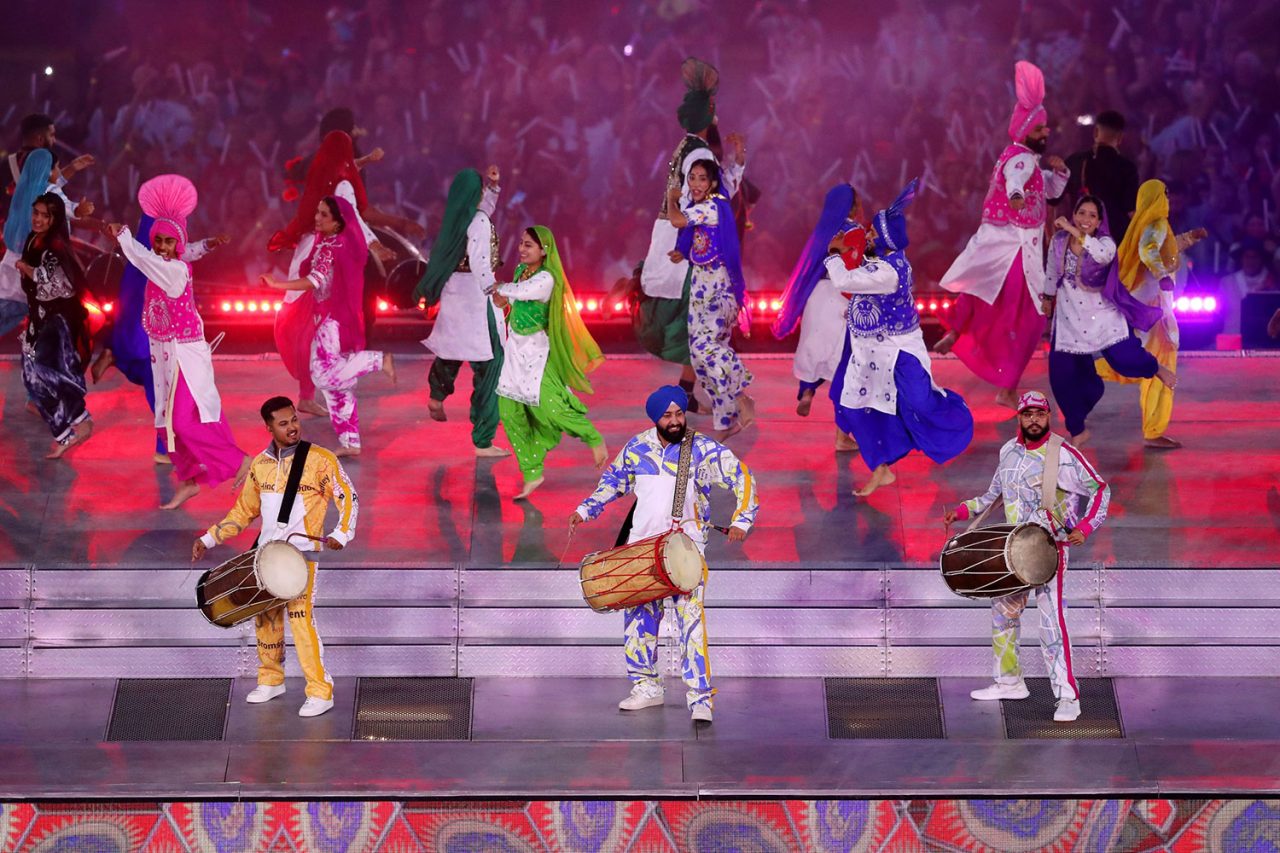 Colourfully dressed dancers perform at the Birmingham 2022 Commonwealth Games ceremony.