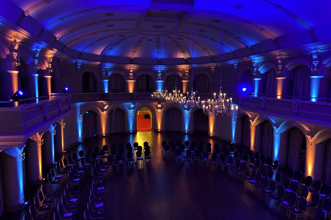 Blue and amber uplighting around the ballroom during Let Us Dance in Perth.