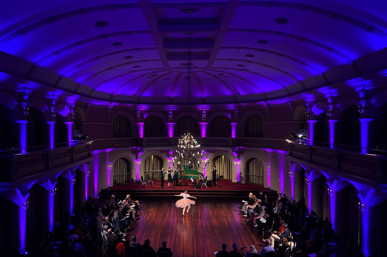 Purple lighting around the ballroom and audience during Let Us Dance in Perth.
