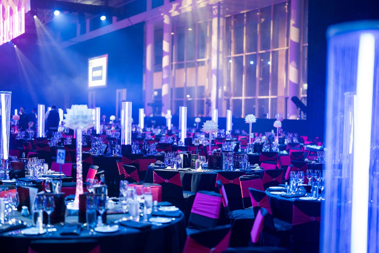 Vertical light tubes among banquet tables at the 2022 Master Builders Australia awards.