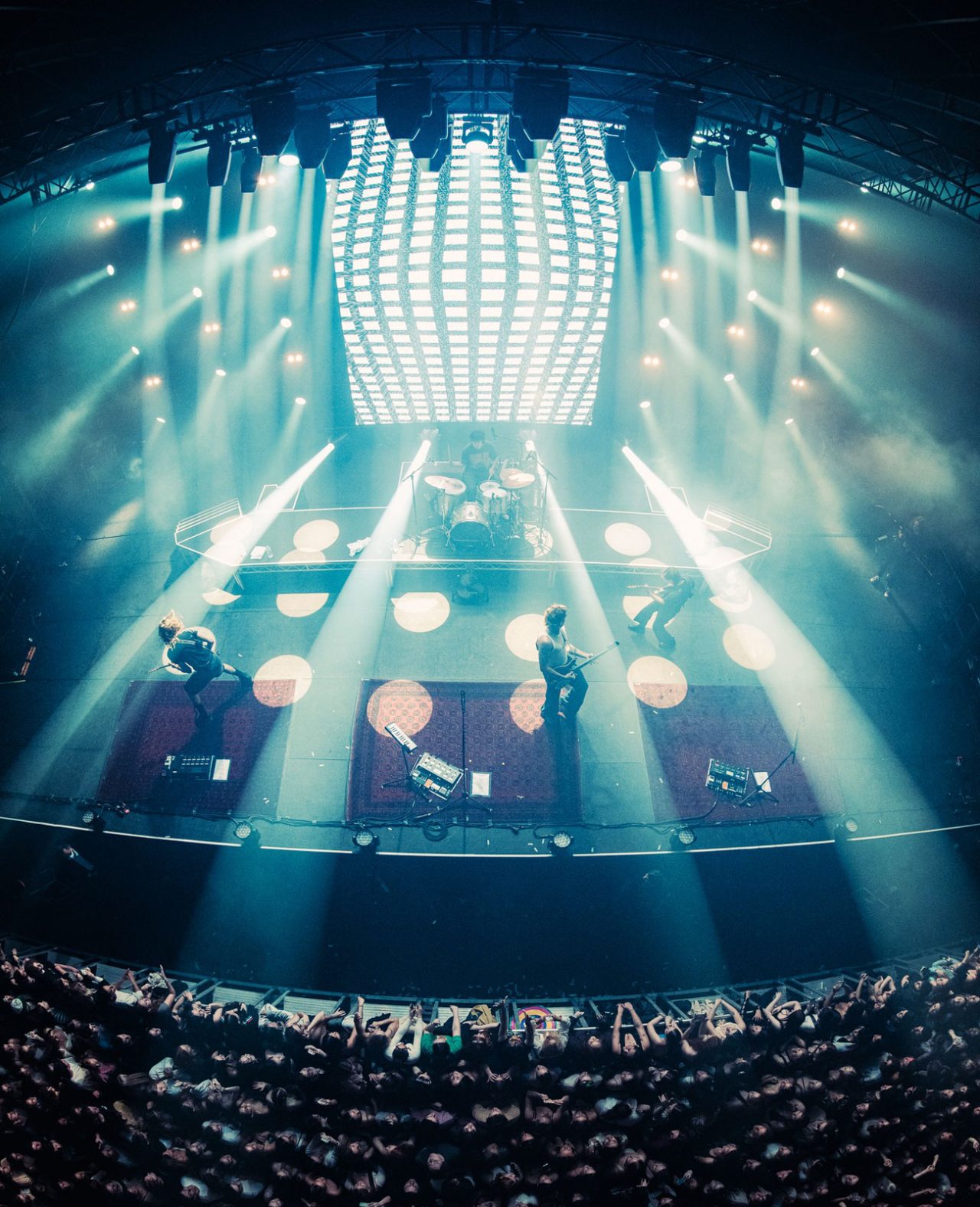 Wide view of the band and large overhead lighting arrays on the Spacey Jane tour.