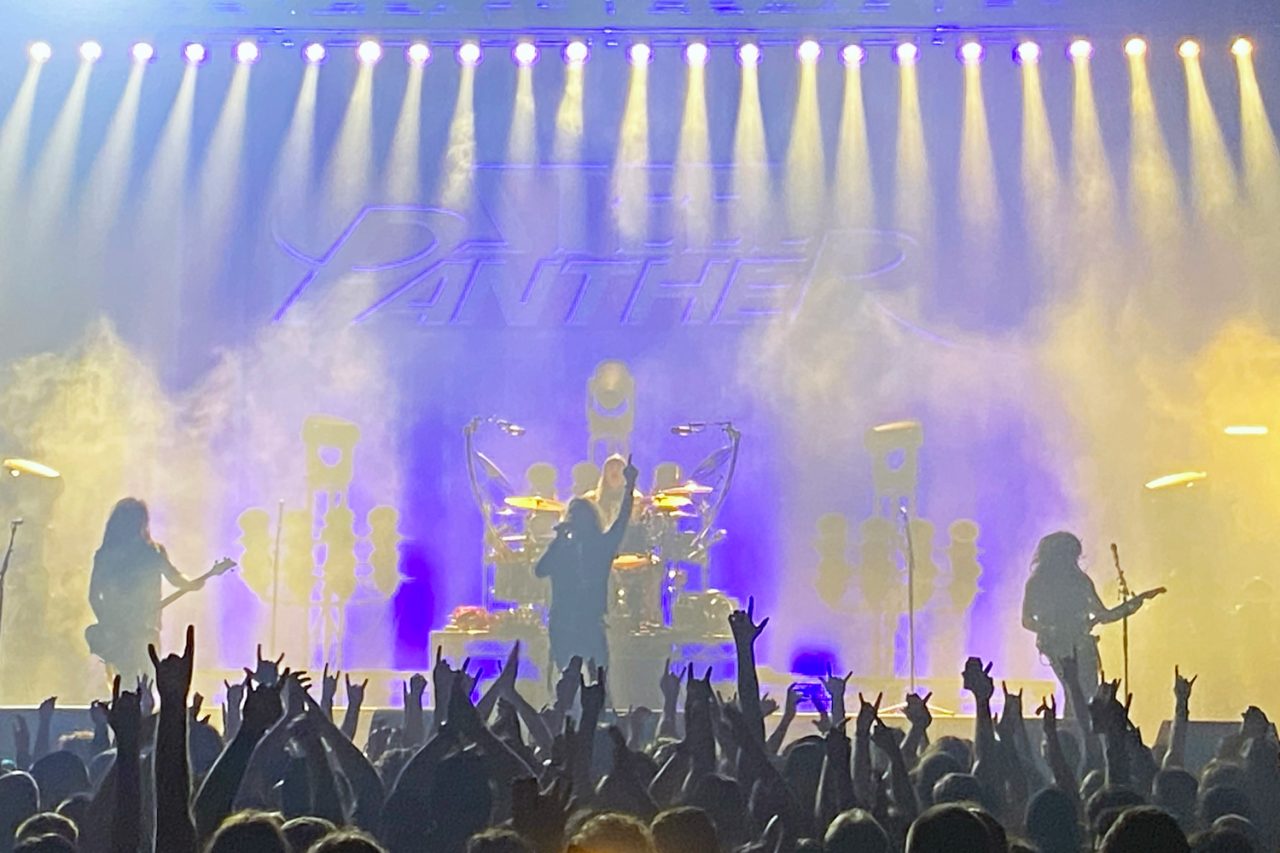 Yellow beams above the band and crowd during Steel Panther's Australian tour.