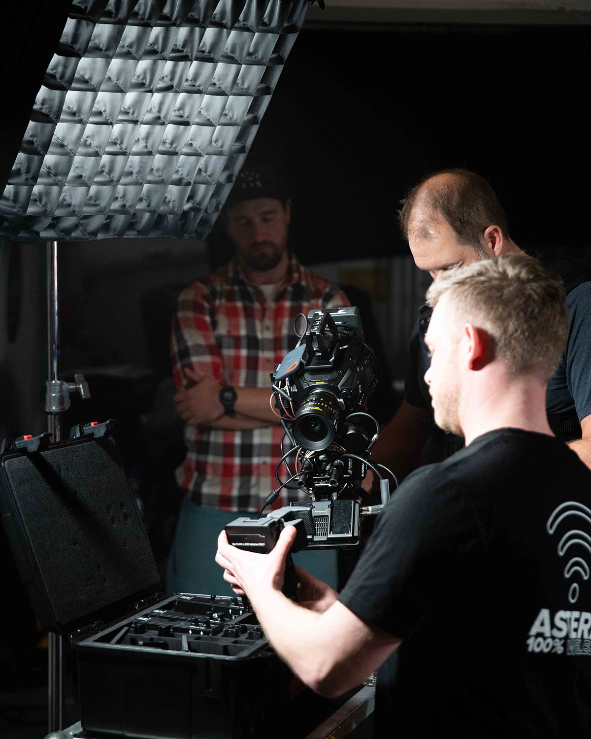 Lighting technician handles equipment during an Astera RuntimeExtender demonstration.