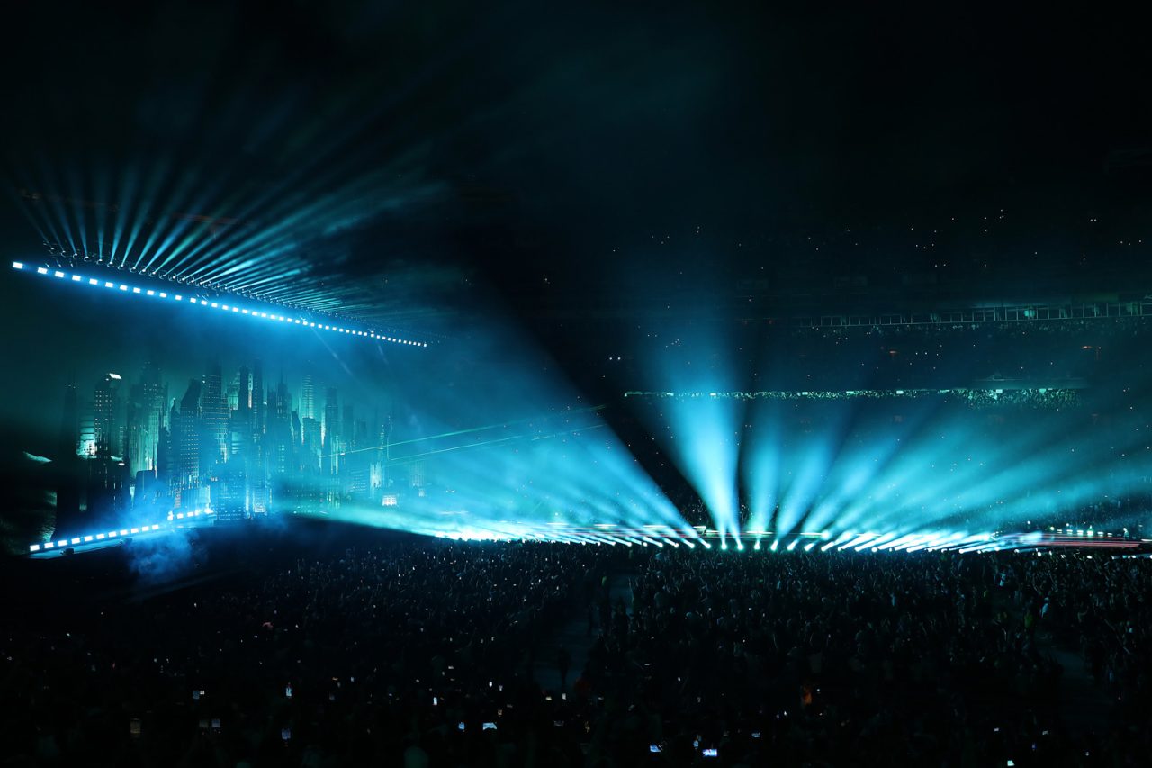 Blue beams sweep over the stadium crowd on the After Hours til Dawn tour.