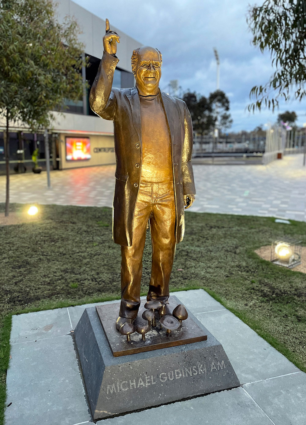 Side view of the uplighted Michael Gudinski memorial and its plinth.