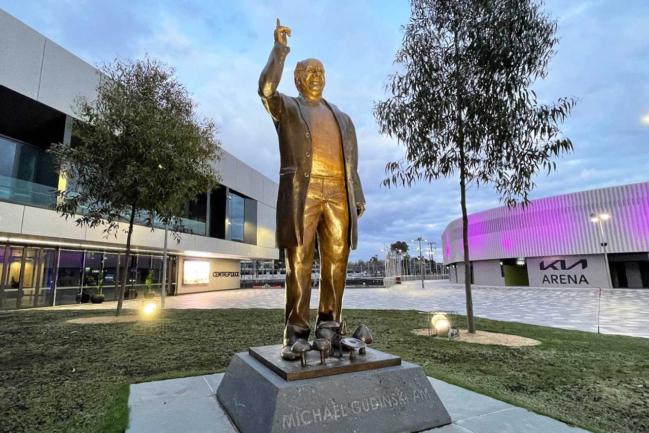 Wide view of the Michael Gudinski memorial and surrounding lawns outside Rod Laver Arena.