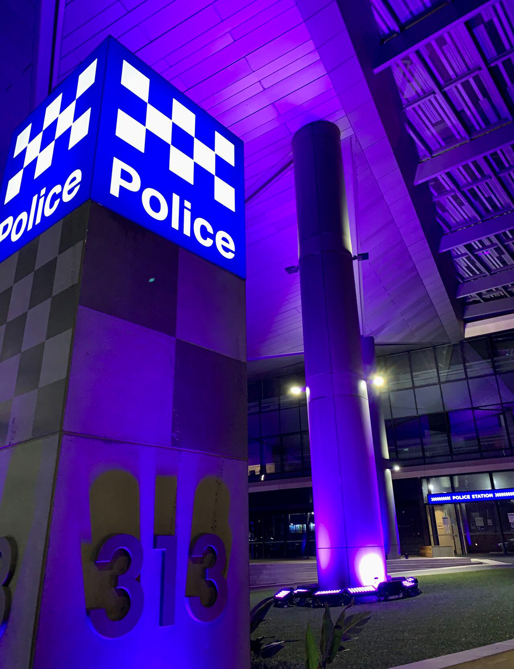 Purple lighting around the Victoria Police Centre entrance for the campaign against violence against women.