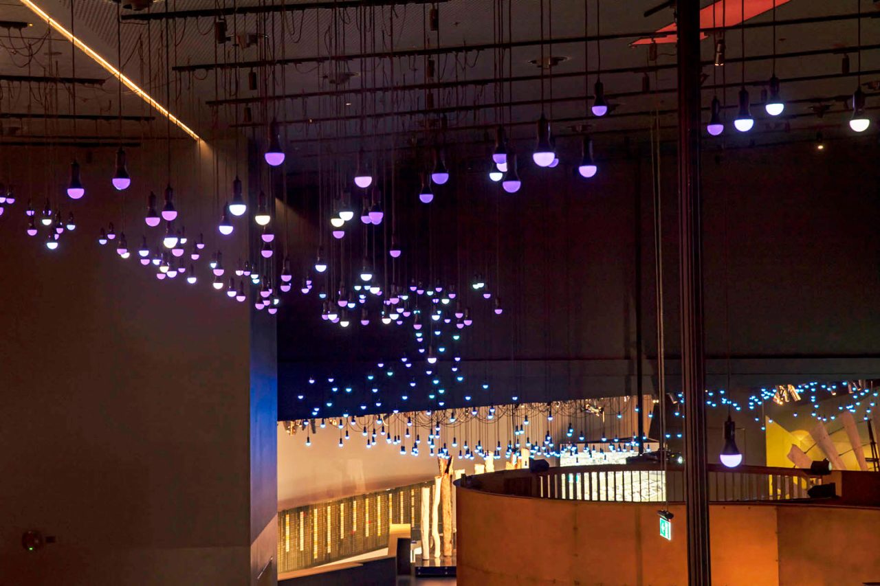 Suspended illuminated bulbs across the National Museum of Australia's gallery ceiling.