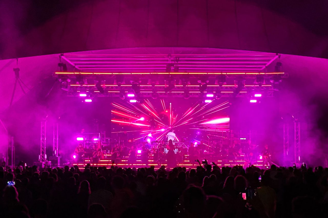 Magenta beams fan across the Ministry of Sound Orchestral stage in Canberra.