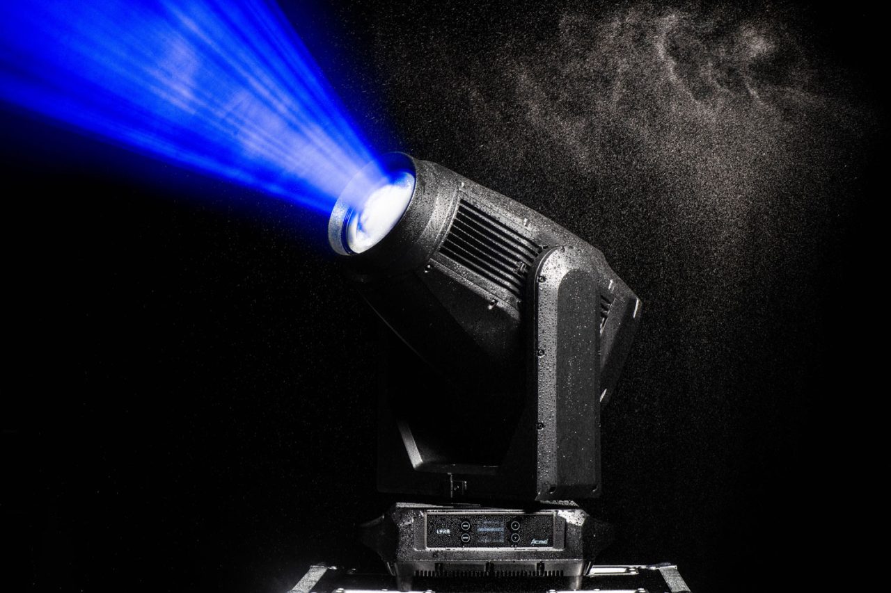 Acme Lyra fixture projects a blue beam through mist.