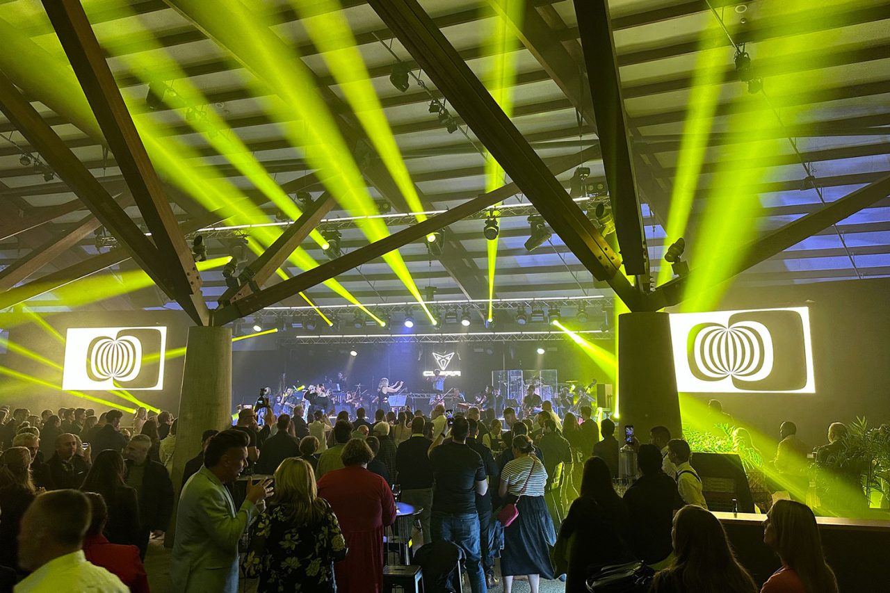 Yellow beams above guests at the Cupra Born launch in Canberra.