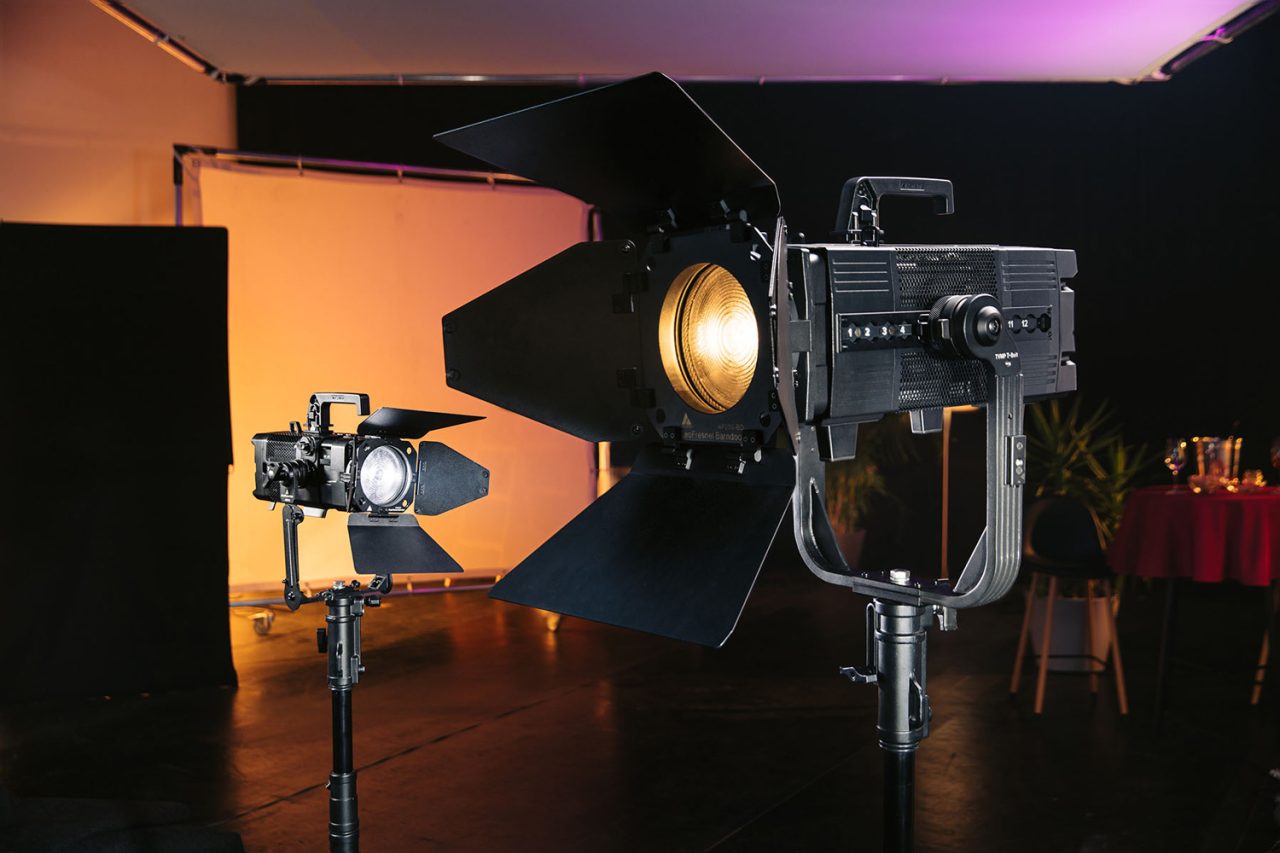 Astera PlutoFresnel and LeoFresnel fixtures with barn doors in a studio setup.