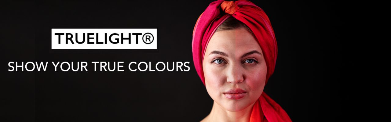 TrueLight Show Your True Colours graphic beside a portrait with a red head wrap.