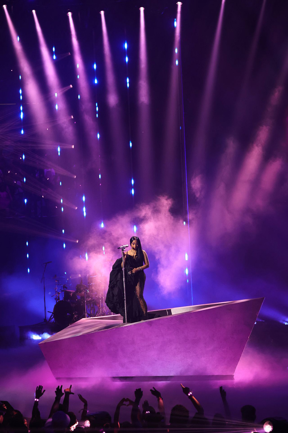 Performer on an elevated platform framed by purple vertical beams at the 2023 MTV VMAs.