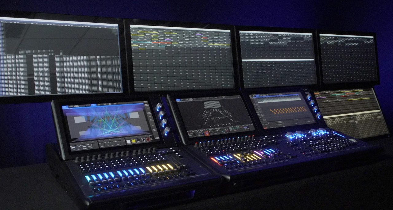 ChamSys lighting control setup with multiple consoles and external displays.