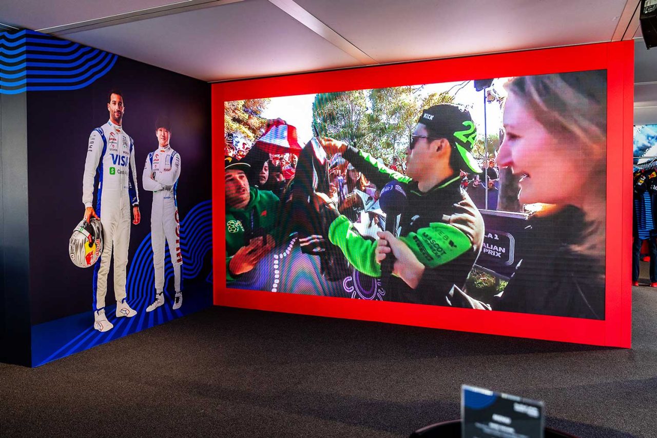 Red-framed video display in a sponsor activation at the 2024 Australian Grand Prix.