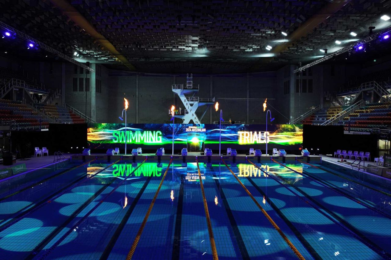 Coloured lighting across the pool and digital backdrop at the 2024 Australian swimming trials.