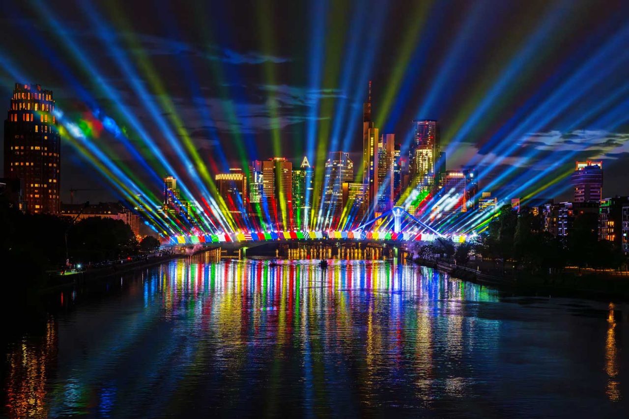 Multicoloured beams above the Main River in Frankfurt for the UEFA EURO 2024 opening celebration.