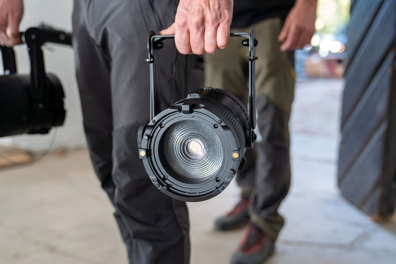 Person carrying an Astera QuikSpot by its handle.