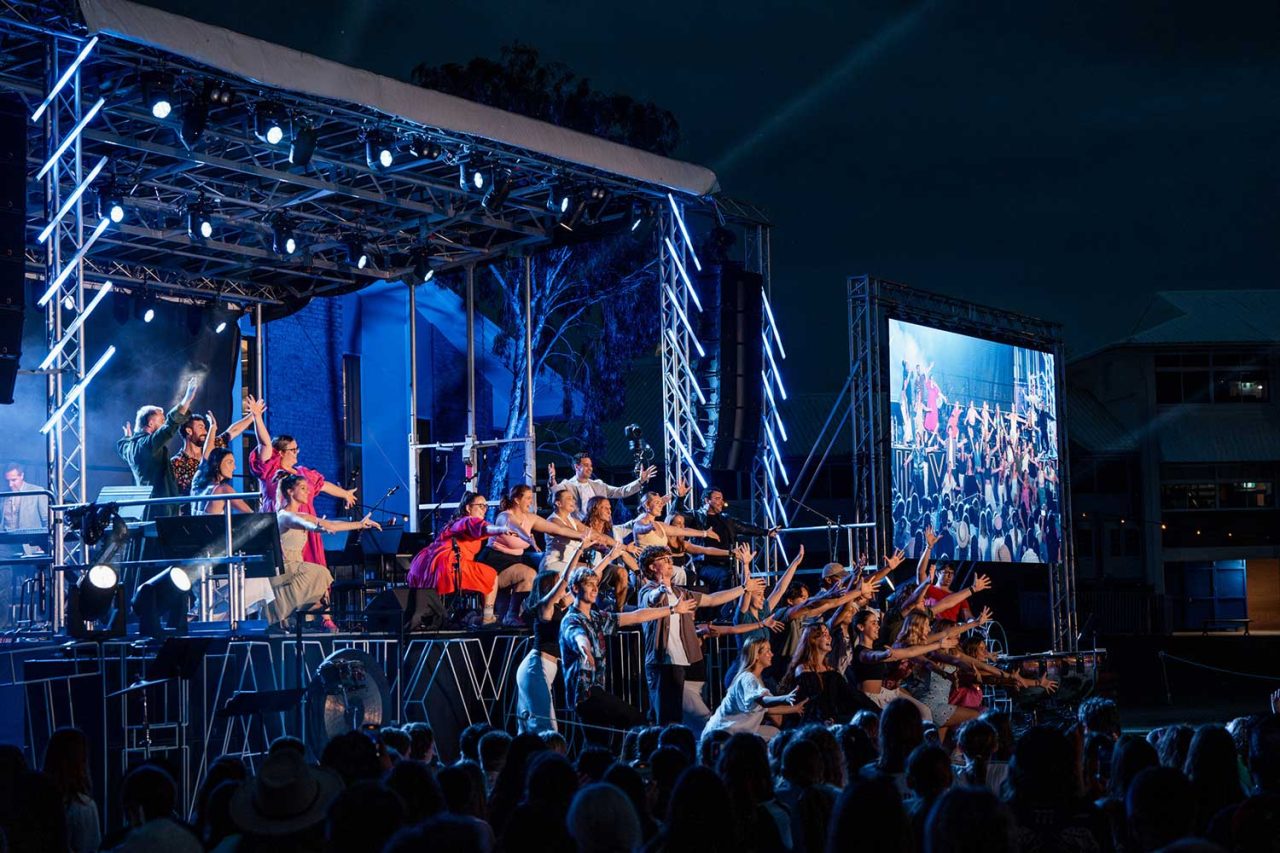 Wide view of the orchestra, light tubes and side screen at All Saints Anglican School.