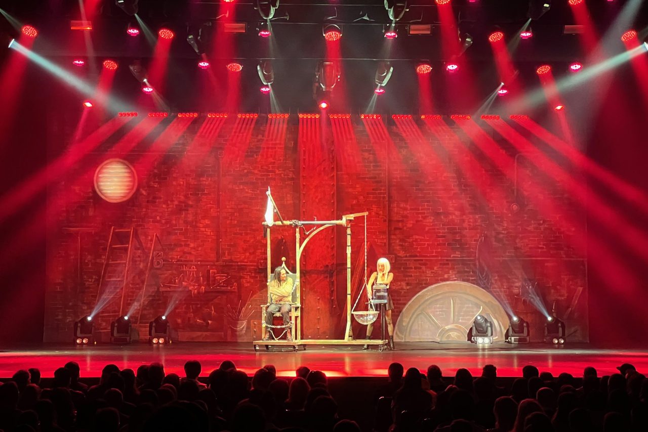 Red lighting around the illusion set during Cosentino's Decennium show.