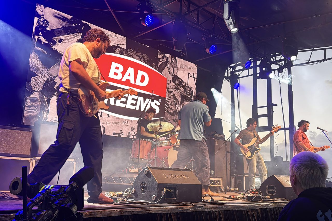Band performs in front of a Bad Dreems video backdrop at the Gold Coast Pro.