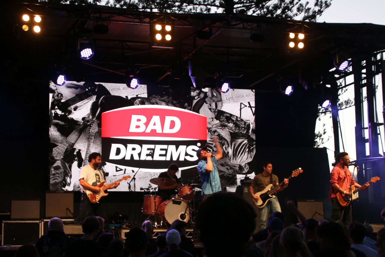 Wide view of the band and Bad Dreems screen at the Gold Coast Pro stage.