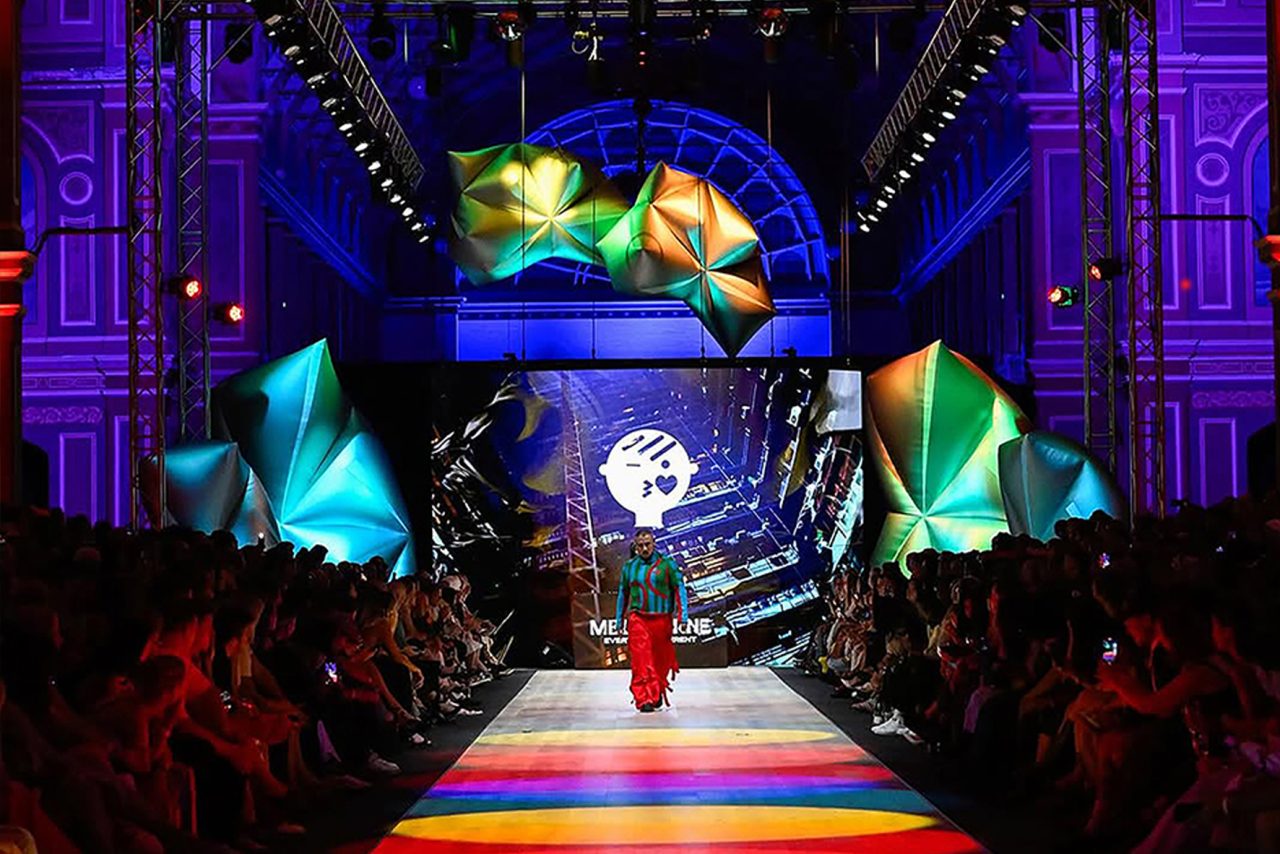 Colourful digital scenery and purple architectural lighting around the runway at Melbourne Fashion Festival.
