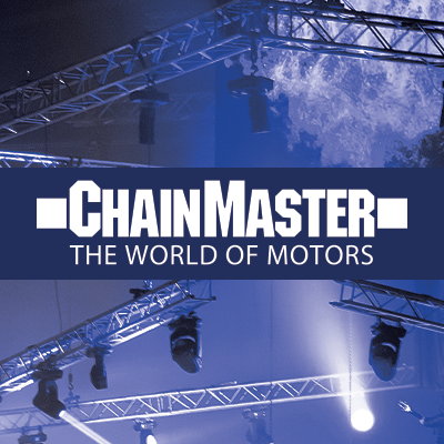 Chainmaster The World of Motors branding above a stage rig.
