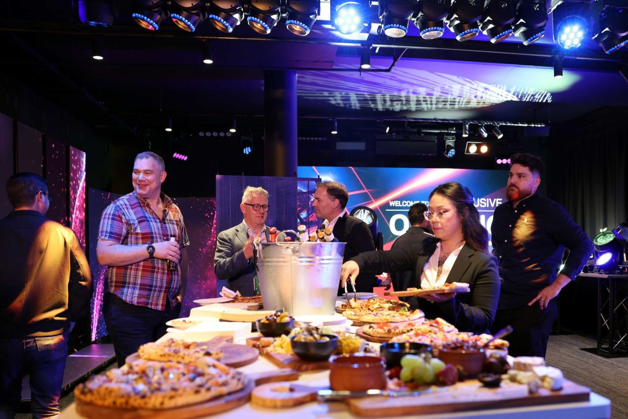 Guests gathered beside refreshments during the ULA Sydney showroom opening.