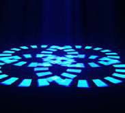 Blue segmented geometric gobo pattern projected onto the floor.