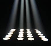 Rows of white circular spots projected onto the floor by an Acme Mana fixture.