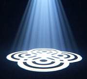 White floral gobo pattern projected onto the floor beneath visible beams.