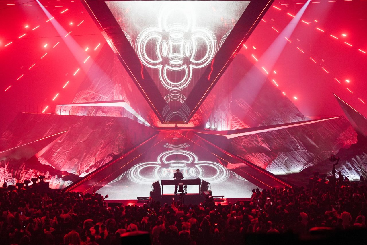 Red-lit triangular stage and screens at the E-Sports World Cup opening ceremony.