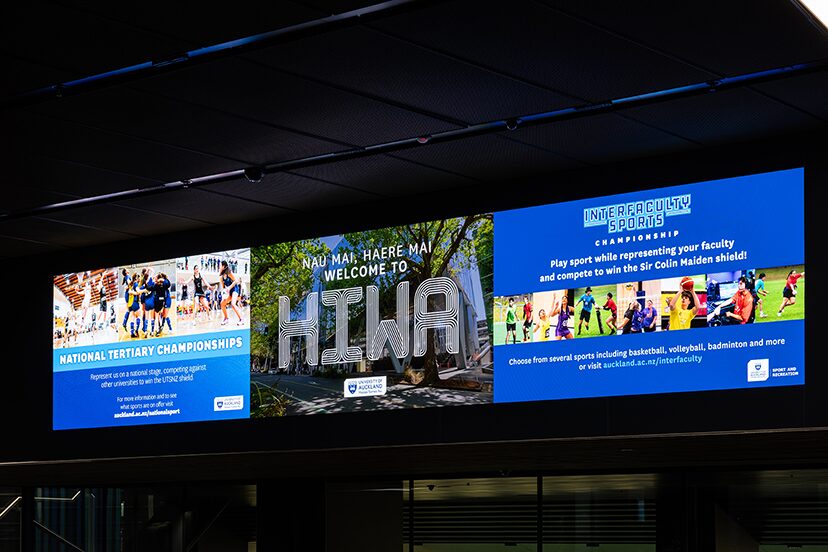 Wide digital information display featuring Hiwa branding and activity images.