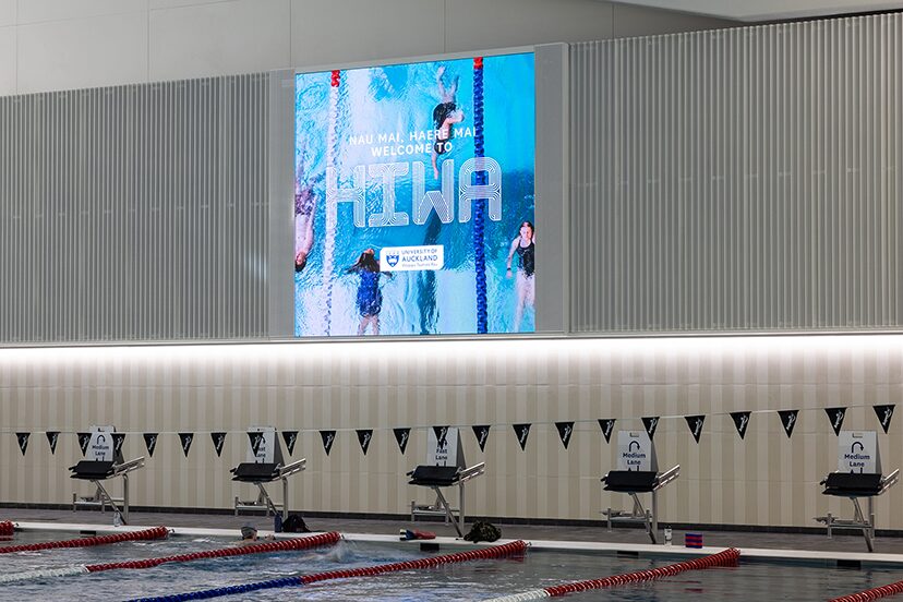 Vertical digital display above the pool starting blocks at Hiwa.